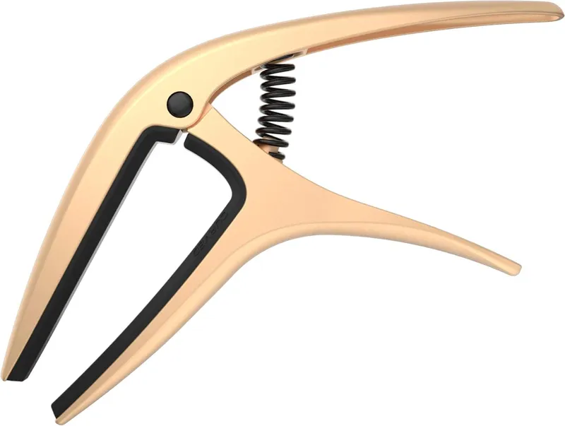 Ernie Ball Axis dual radius capo in gold satin.